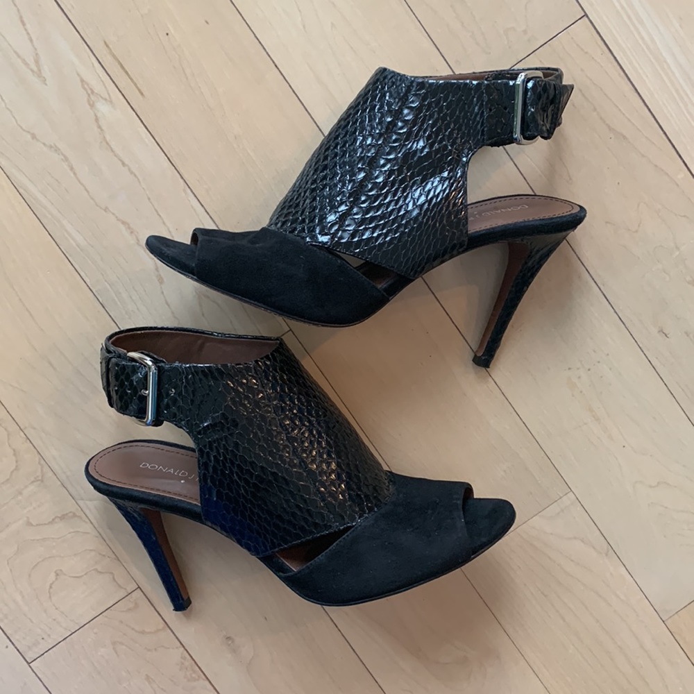 Donald Pliner black suede/reptile print heels with silver buckles. Open toe.